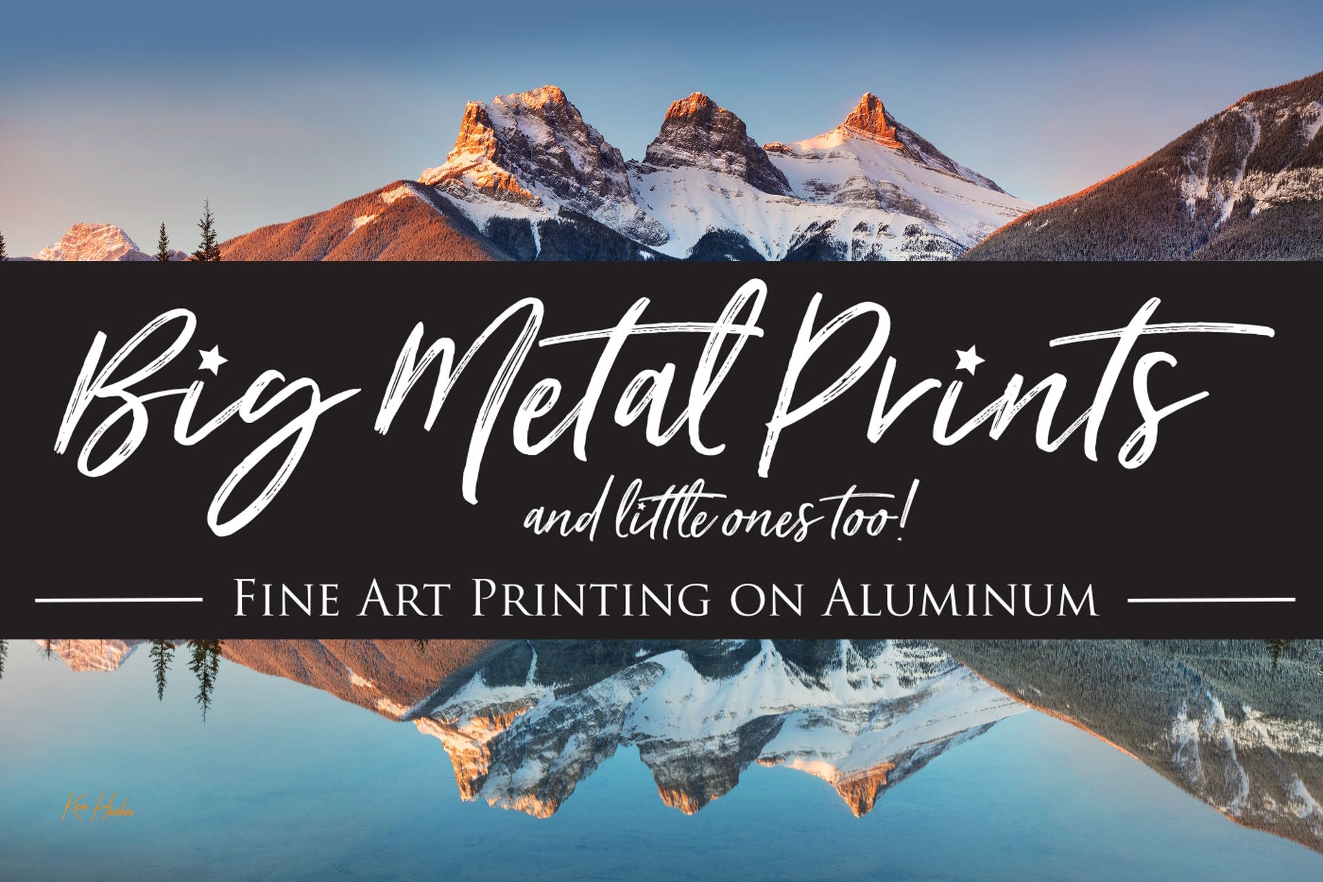 Landscape Header image of Snowy Three Sisters Mountain with lake reflection & Big Metal Prints banner overlay
