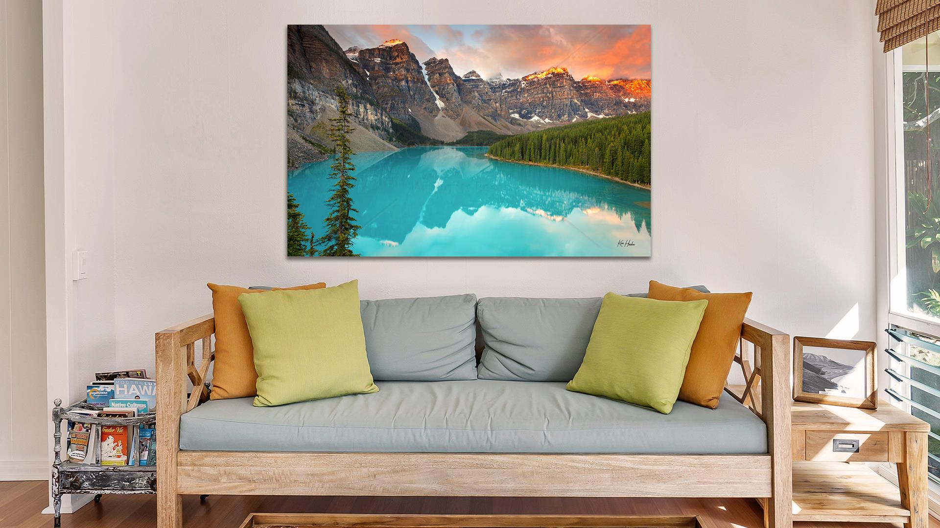 Living room with wood coffee table, couch and Moraine Lake wall art - 1920 x 1080 size