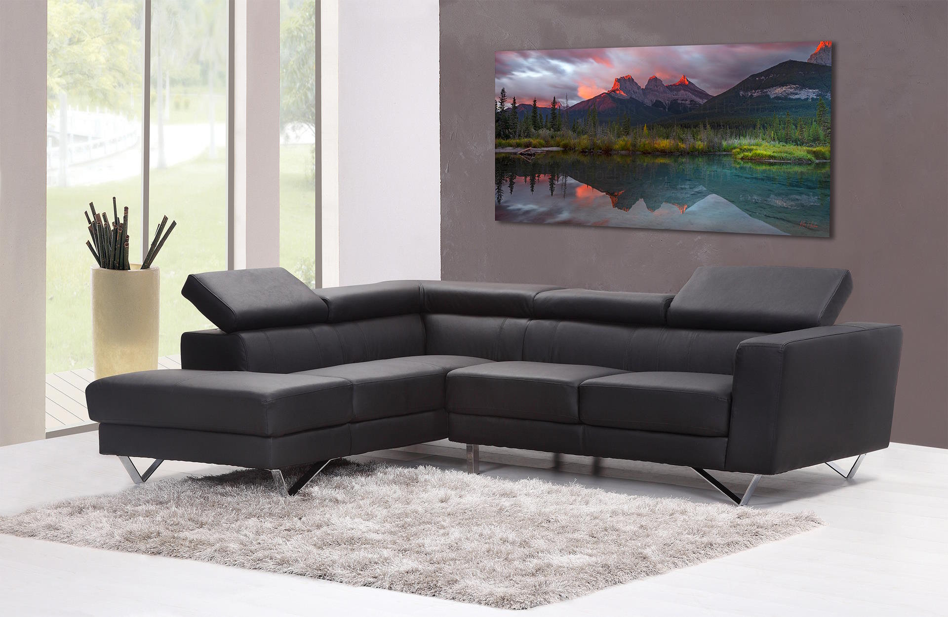 Dark wall, modern couch, fuzzy carpet with artwork wall hanging showing mountain, lake landscape